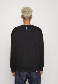 Carhartt WIP GEO SCRIPT - Camisola - black