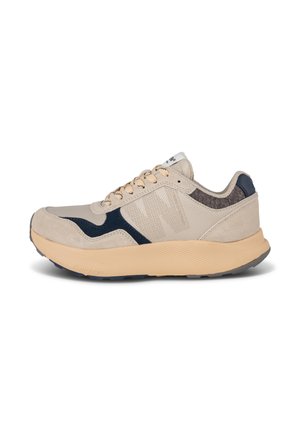 Beige athletic shoes featuring a mesh upper, navy accents, textured materials, and round laces. Thick sole with a wave pattern for traction.