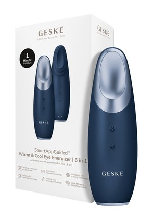 Mørkeblå øjemassager med metalspids, der viser temperaturskontrolknapper, vist ved siden af hvid emballage med produktdetaljer.