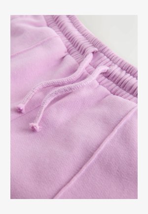 Helle rosa Jogginghose mit einem gerippten Bund und passenden Kordeln, aus weichem, strukturiertem Stoff und ohne sichtbare Taschen.