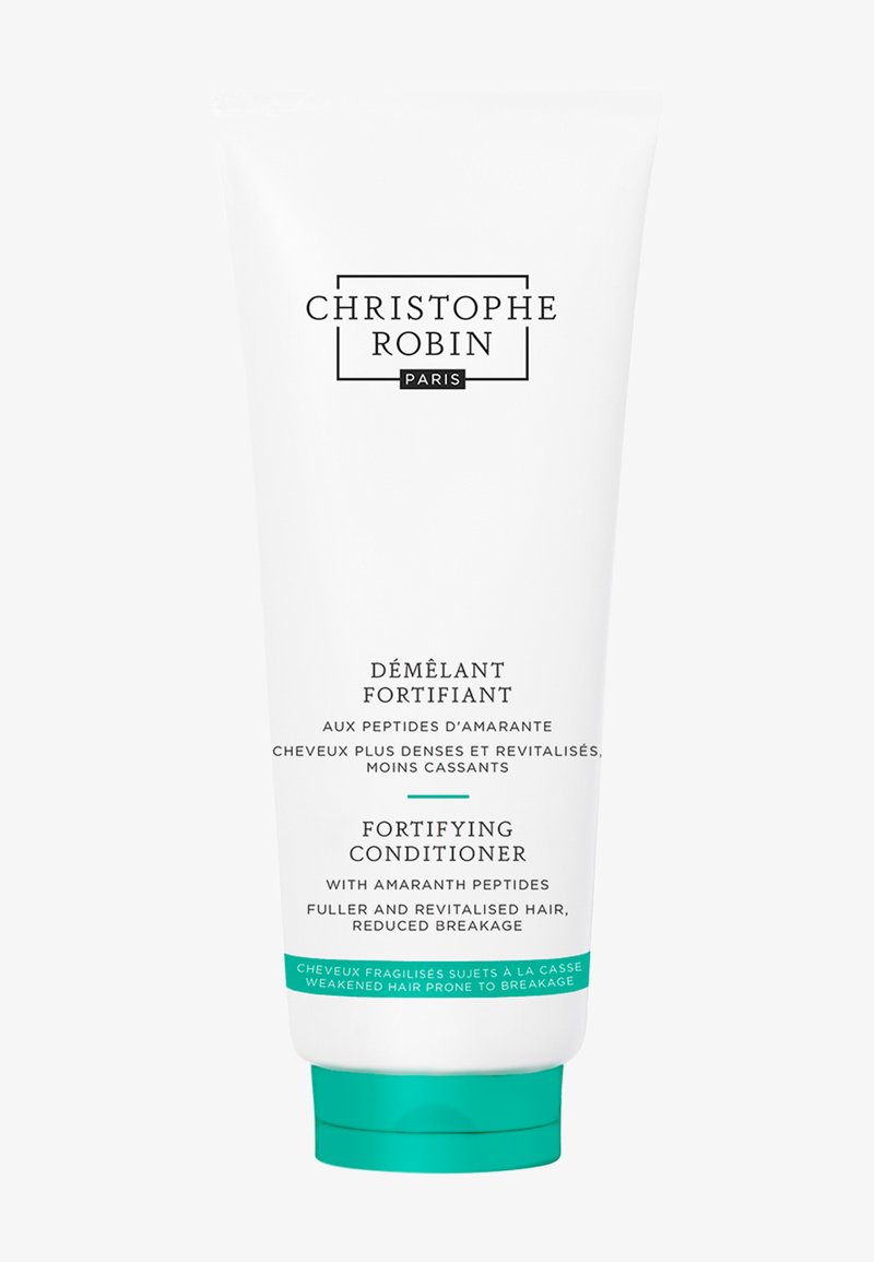 Après-shampoing fortifiant dans un tube blanc lisse, avec un accent teal à la base. Le texte comprend "Christophe Robin" et les détails du produit en noir.