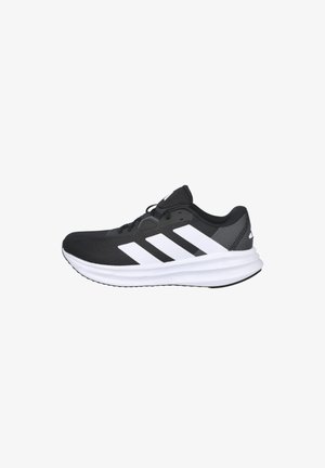 Zapatos deportivos negros con detalles en blanco, con una parte superior de malla texturizada, suela acolchada y tres franjas blancas prominentes en el lateral.