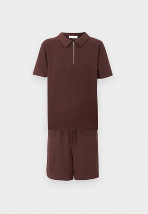Brown textured short-sleeve polo shirt with front zipper paired with matching drawstring shorts against white background.