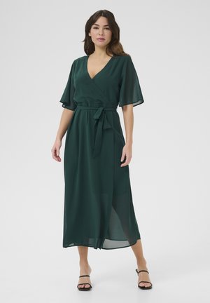 Green chiffon wrap dress with short flutter sleeves, a tie belt at the waist, and a flowing silhouette, featuring a mid-length cut.