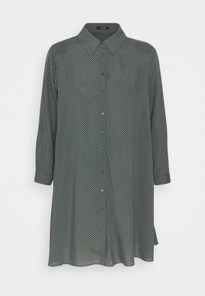Camicia a bottone verde scuro con maniche lunghe, caratterizzata da un motivo a pois bianchi, colletto classico e orlo dritto. Realizzata in tessuto morbido.