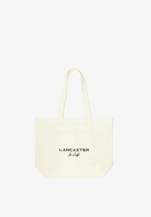 Sac fourre-tout écru avec des bretelles présentant le texte noir « LANCASTER Le Café » imprimé au centre sur un fond uni.