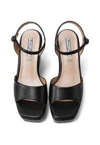 Sandali neri in pelle con tacco alto, design con punta aperta, cinturino regolabile alla caviglia e soletta liscia. Tacco a forma quadrata.