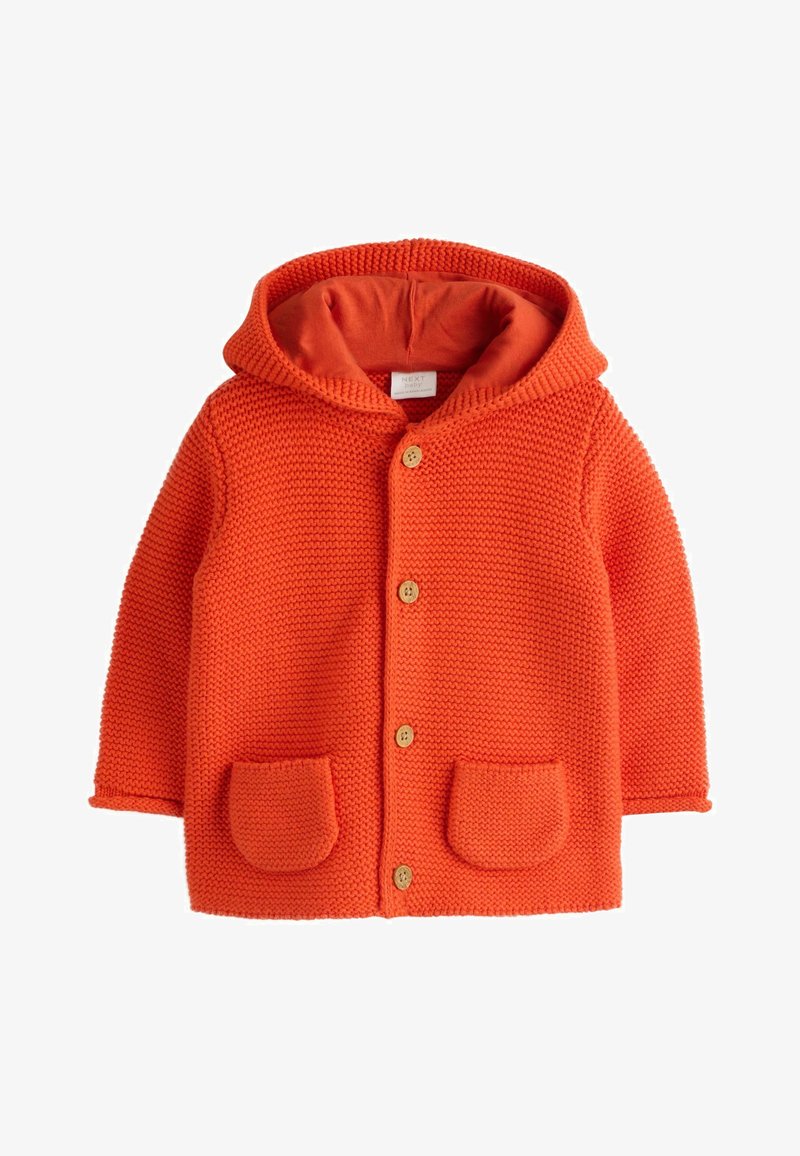 Pomarańczowy dziany płaszcz z kapturem o fakturowanej tkaninie, drewnianymi guzikami i dwoma przednimi kieszeniami. Kaptur podszyty tkaniną w pasującym pomarańczowym kolorze.