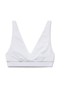 Bralette bianco in cotone con un design a scollatura profonda a V, spalline larghe e una fascia senza cuciture nella parte inferiore. Texture morbida, senza imbottitura.