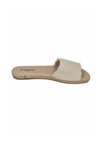 Beige fabric slide sandal with a frayed strap and woven jute sole. Flat design, open toe, and a smooth insole with branding detail.