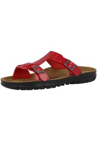Red synthetic slide sandal with two adjustable straps, cork footbed, and a black rubber outsole. Designed for comfort and breathability.
