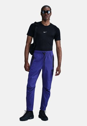 PANT - Verryttelyhousut - deep night black