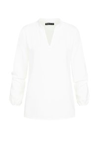 Camicia bianca a maniche lunghe con scollatura a V. Presenta maniche arricciate e una texture sottile. L'etichetta allerta "CLOUD SVE" sul colletto.