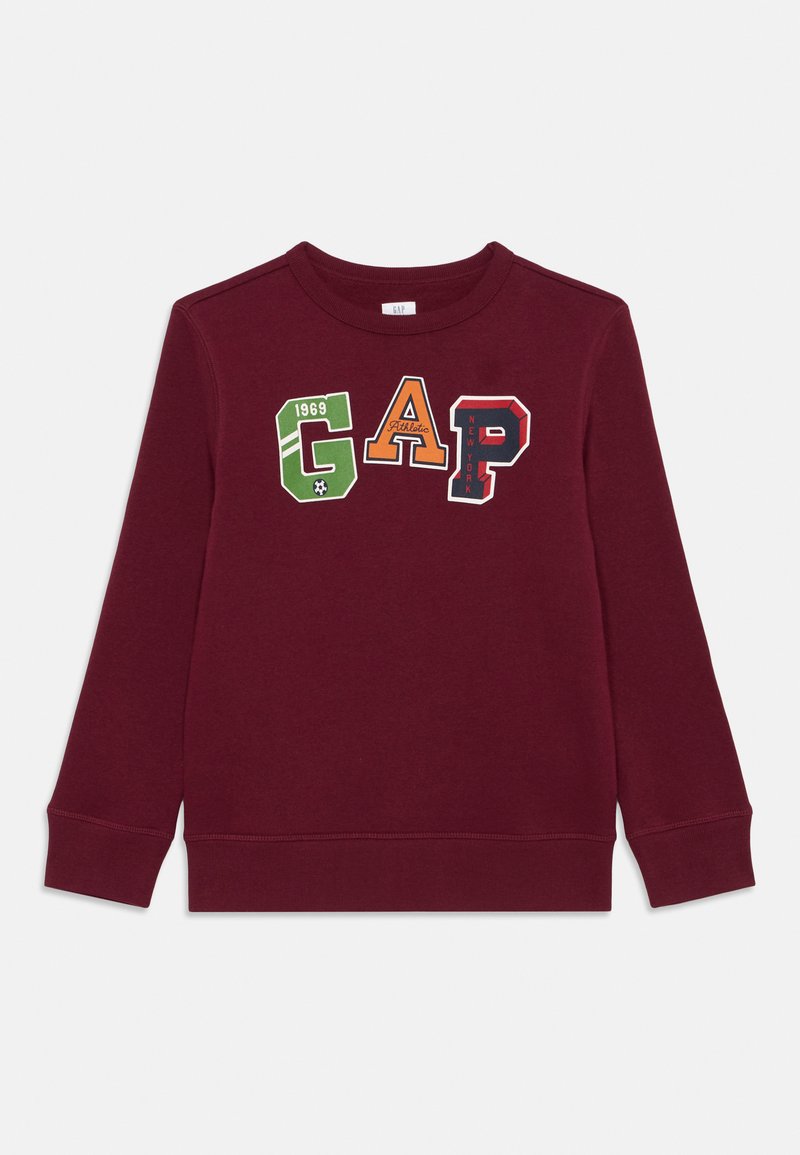 Bordo sporta krekls ar apaļu kakla izgriezumu, ribotām piedurknēm un apakšmalu. Apdrukā ir burti "GAP" un "1969" zaļā, oranžā, tumši zila un sarkanā krāsā.