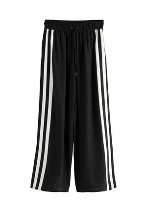 Black wide-leg pants with elastic waist and front drawstring, featuring three white vertical stripes on each side.