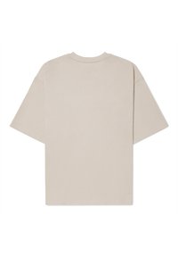 Beige bavlněné tričko s uvolněným střihem, krátkými rukávy, kulatým výstřihem a bez viditelných log nebo vzorů na zádech.