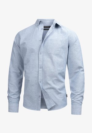 Light blue button-up shirt in a soft, textured fabric. Features a pointed collar, single chest pocket, and buttoned cuffs with rounded hem.