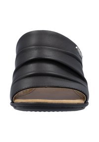 Black slide sandal with three pleated leather straps, open toe design, soft beige inner lining, and textured black outsole. Silver accent detail.