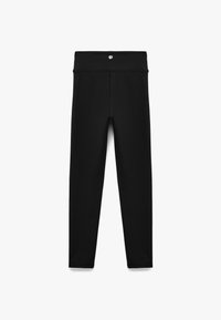 Svarta leggings tillverkade av ett slätt, elastiskt material. Har en bred midjeresår och en sömlös design utan synlig hårdvara eller mönster.