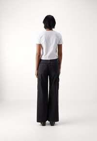 Calvin Klein Jeans MONOLOGO - Pamata T-krekls - bright white