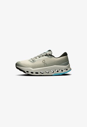 Light gray running shoe with a textured mesh upper, black accents, and blue details. Features a chunky sole with cutouts for ventilation.