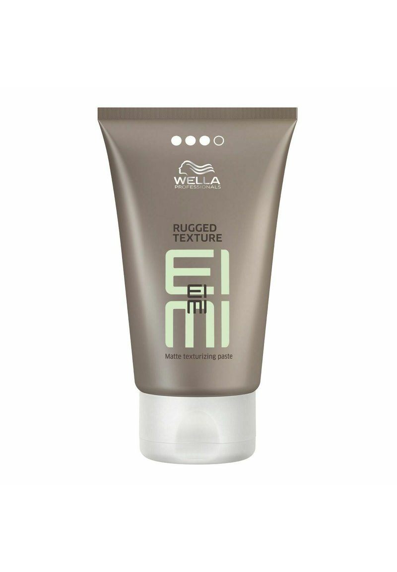 Bruine knijptube met matte afwerking, groene tekst en logo; gelabeld "Rugged Texture EIMI Matte Texturizing Paste" aan de voorkant.