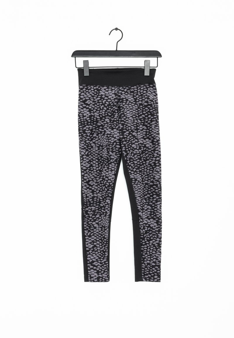Leggings à motifs noir et gris avec une taille haute, présentant une texture lisse et des panneaux latéraux mettant en valeur le design.