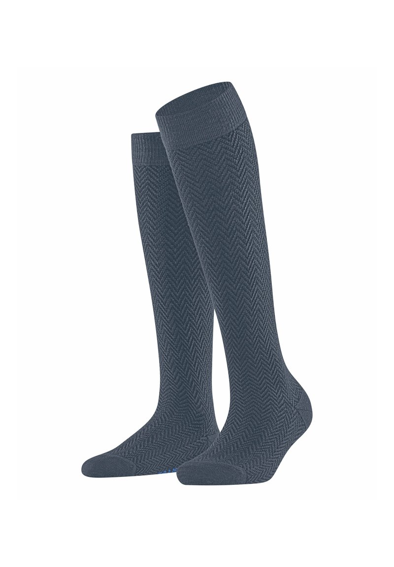 Calze al ginocchio di colore grigio scuro con motivo a spina di pesce, dotate di bordo a coste e finitura liscia. Costruzione durevole per il comfort.