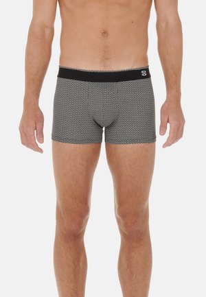 Black and white patterned boxer briefs with a solid black elastic waistband. Made of a soft, stretchy material. Fitted design.