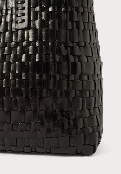 Black woven leather bag featuring a textured surface with interlaced panels, a smooth strap, and a structured shape.