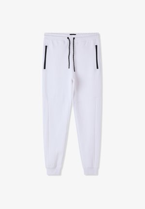 Pantaloni da jogging bianchi in tessuto morbido, con tasche nere con zip, vita elastica con coulisse e polsini alle caviglie svasati.