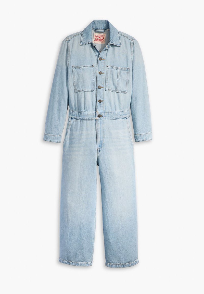 Lyseblå denimdragt med lange ærmer, knappelukning foran, to brystlommer og en indsnøret talje for en skræddersyet pasform.