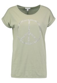 Svetle zelené tričko s krátkým rukávem a s rolovanými manžetami, na přední straně s velkým stříbrným kamínkovým symbolem míru.