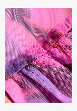 Sheer mesh fabric in shades of pink and purple, featuring a wavy texture with pleats and a gradient color pattern transitioning from light to dark.