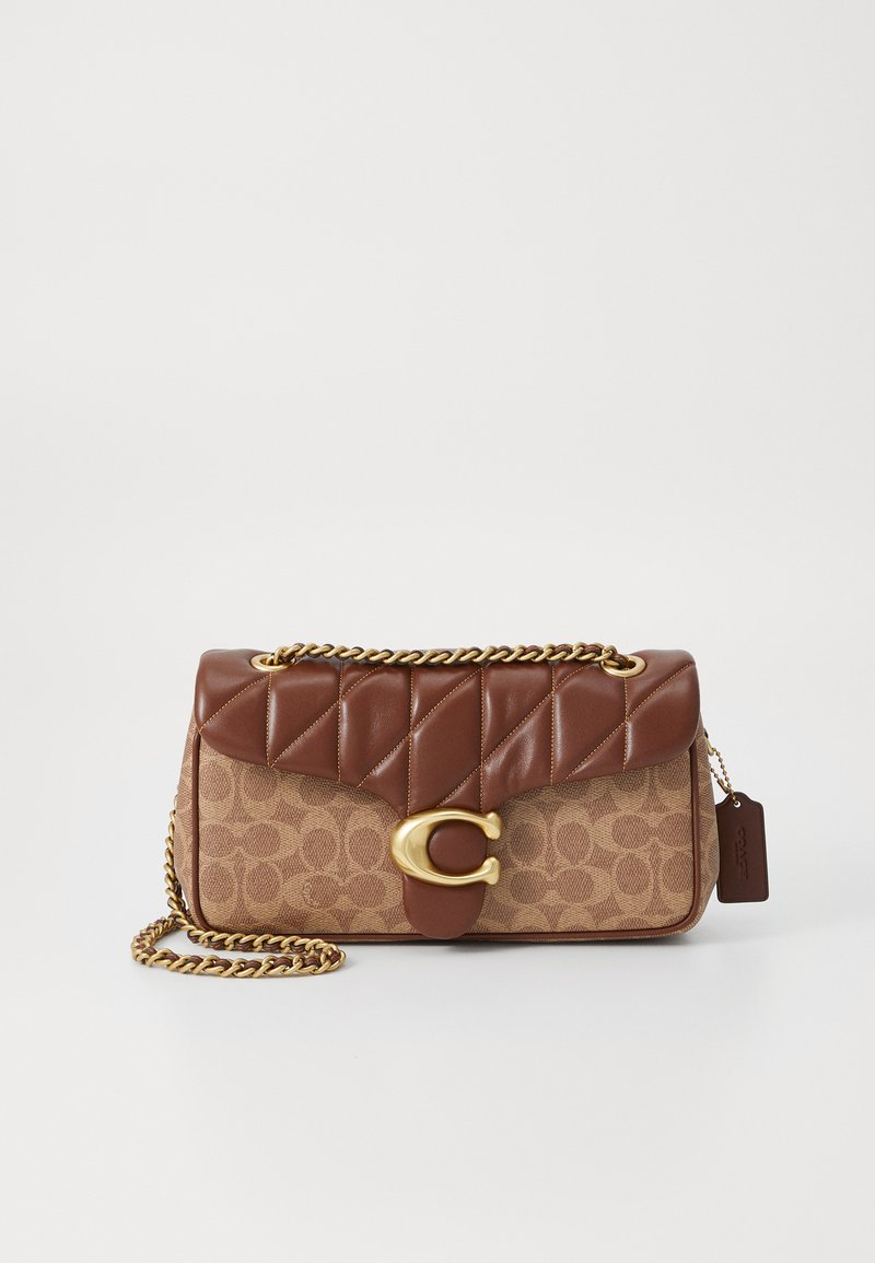Brown leather handbag with quilted top, chain strap, gold hardware, and a monogram pattern on the body. Tag attached to the side.