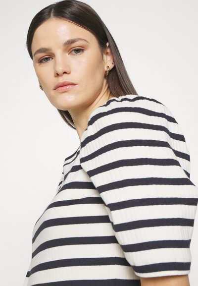 Ribbed top with horizontal navy and white stripes, features a rounded neckline and short puff sleeves, showcasing a smooth texture.