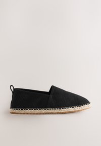 Black slip-on shoe with a textured upper, rounded toe, and woven jute trim. Features a rubber sole and a small heel tab for convenience.
