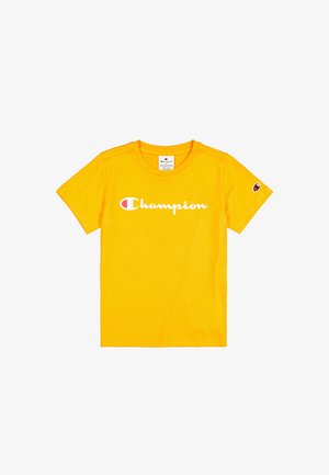 Gelbes Baumwoll-T-Shirt mit kurzen Ärmeln; verfügt über das "Champion"-Logo in Weiß. Kleines Logodetail am linken Ärmel. Klassisches Rundhals-Design.