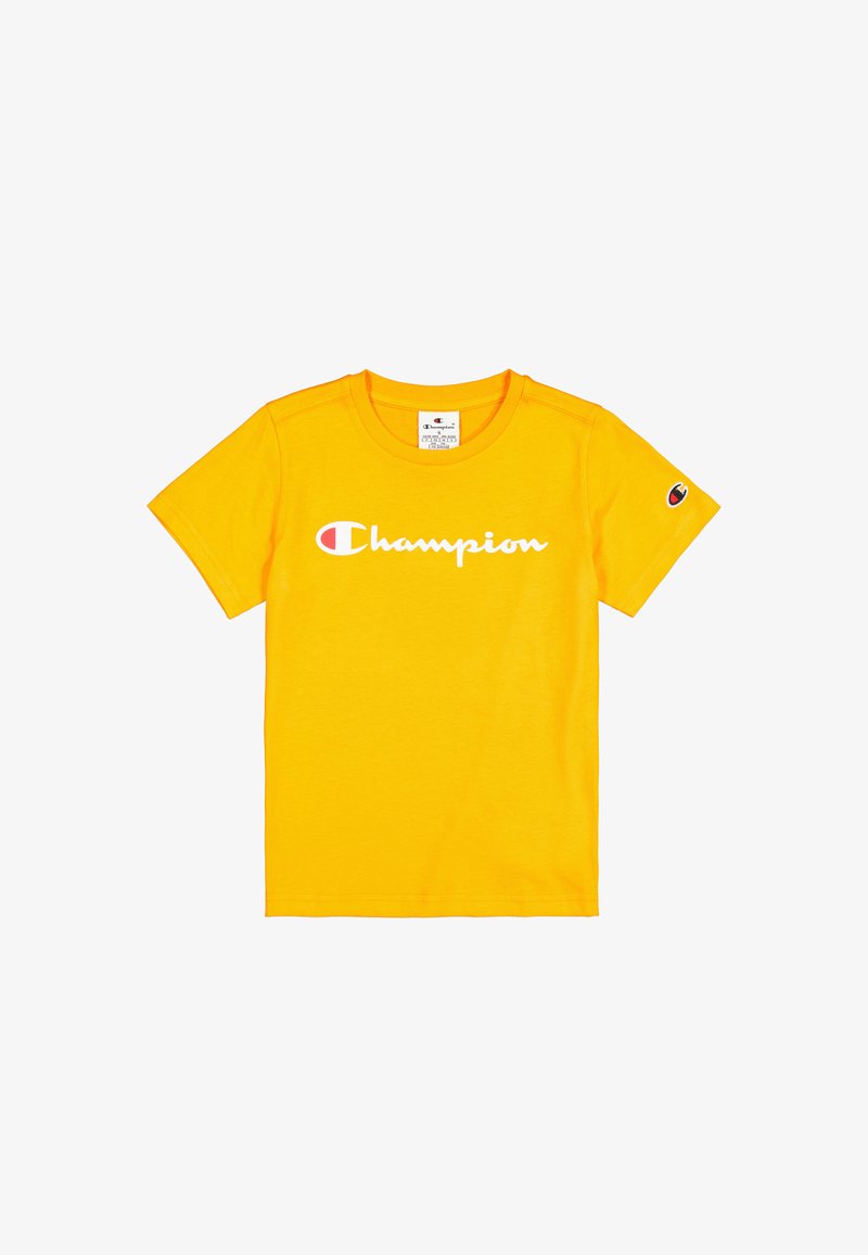 Camiseta de algodón amarilla de manga corta; presenta el logo "Champion" en blanco. Detalle del logo pequeño en la manga izquierda. Diseño clásico de cuello redondo.