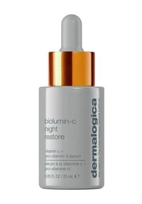 Bottiglia grigia con tappo contagocce, accentata in oro, etichettata "biolumin-c night restore", 25 mL, presenta testo in caratteri neri e grigi.