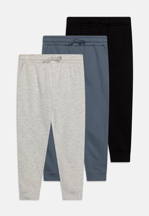 Three pairs of sweatpants in gray, blue, and black. Each has an elastic waistband with drawstring, tapered legs, and side pockets.
