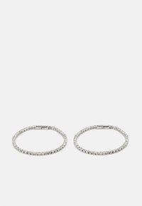 Silver metal hoops adorned with clear rhinestones. The design features a flexible band with a clasp closure, showcasing a uniform pattern of stones.