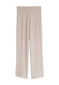 Pantalon large beige en tissu doux et extensible. Il dispose d'une taille élastique lisse et d'une coupe décontractée sur toute la longueur des jambes.