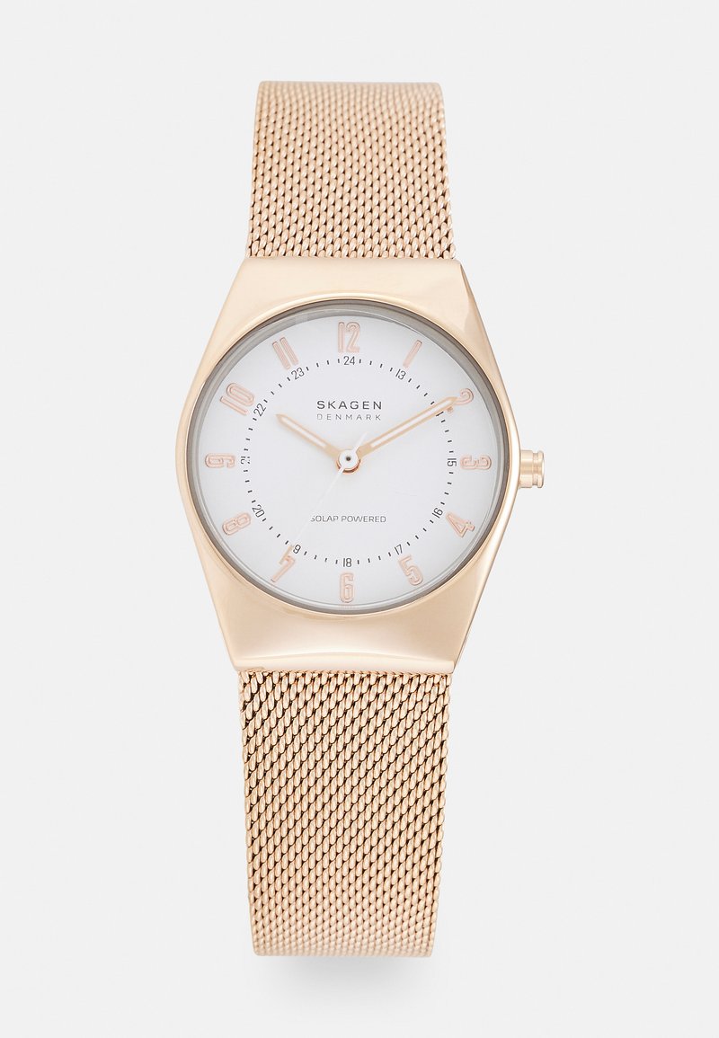 Skagen solar-powered watch with a geometric golden case, white dial, rose gold accents, and a mesh strap. Features minimalist hour markers.
