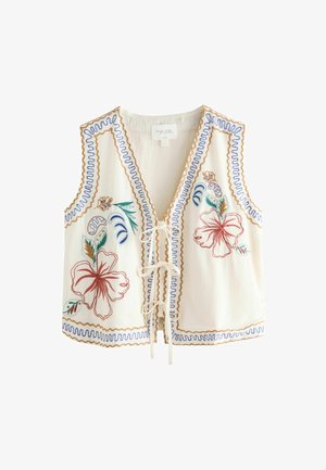 Hvid ærmeløs top med blomsterbroderi i rød, blå og grøn. Har en V-udskæring og en snøre lukning foran. Dekorative sømkanter.