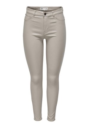 Jean skinny beige en tissu extensible, présentant un design classique à cinq poches et un zip avec un bouton de fermeture.