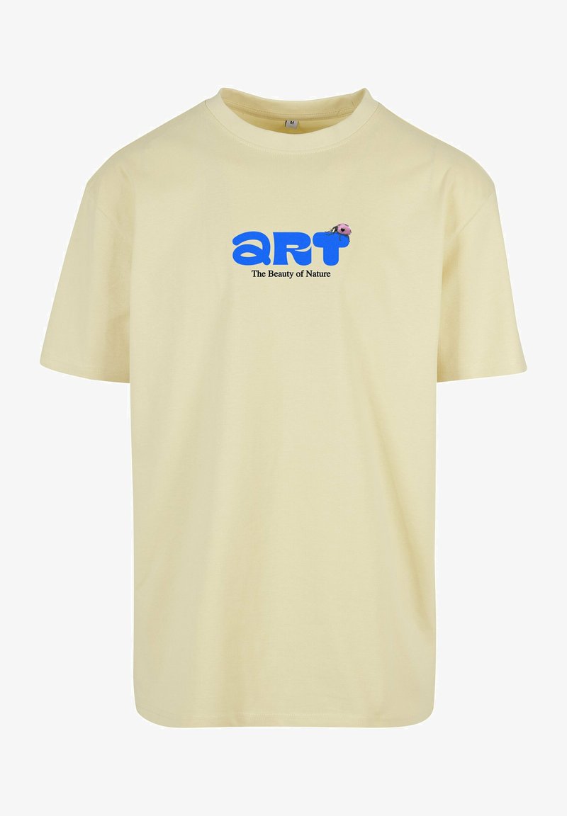 Yellow cotton t-shirt featuring a blue "art" logo and text reading "The Beauty of Nature," with a small pink ladybug graphic. Short sleeves.