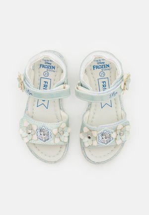 Light blue sandals with floral accents, an Elsa graphic, adjustable straps, and a glittery finish. Designed for children's comfort. Size 25.