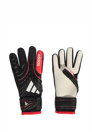 Par de guantes de portero Adidas en blanco y negro con detalles en rojo y correas ajustables en las muñecas, mostrando vistas frontal y trasera.