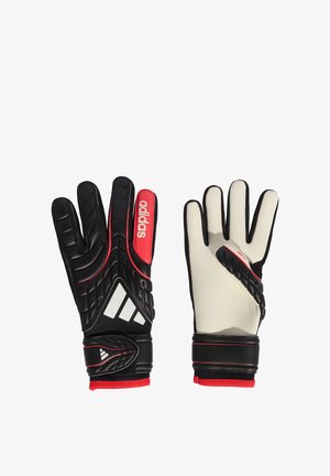 Par de guantes de portero Adidas en blanco y negro con detalles en rojo y correas ajustables en las muñecas, mostrando vistas frontal y trasera.